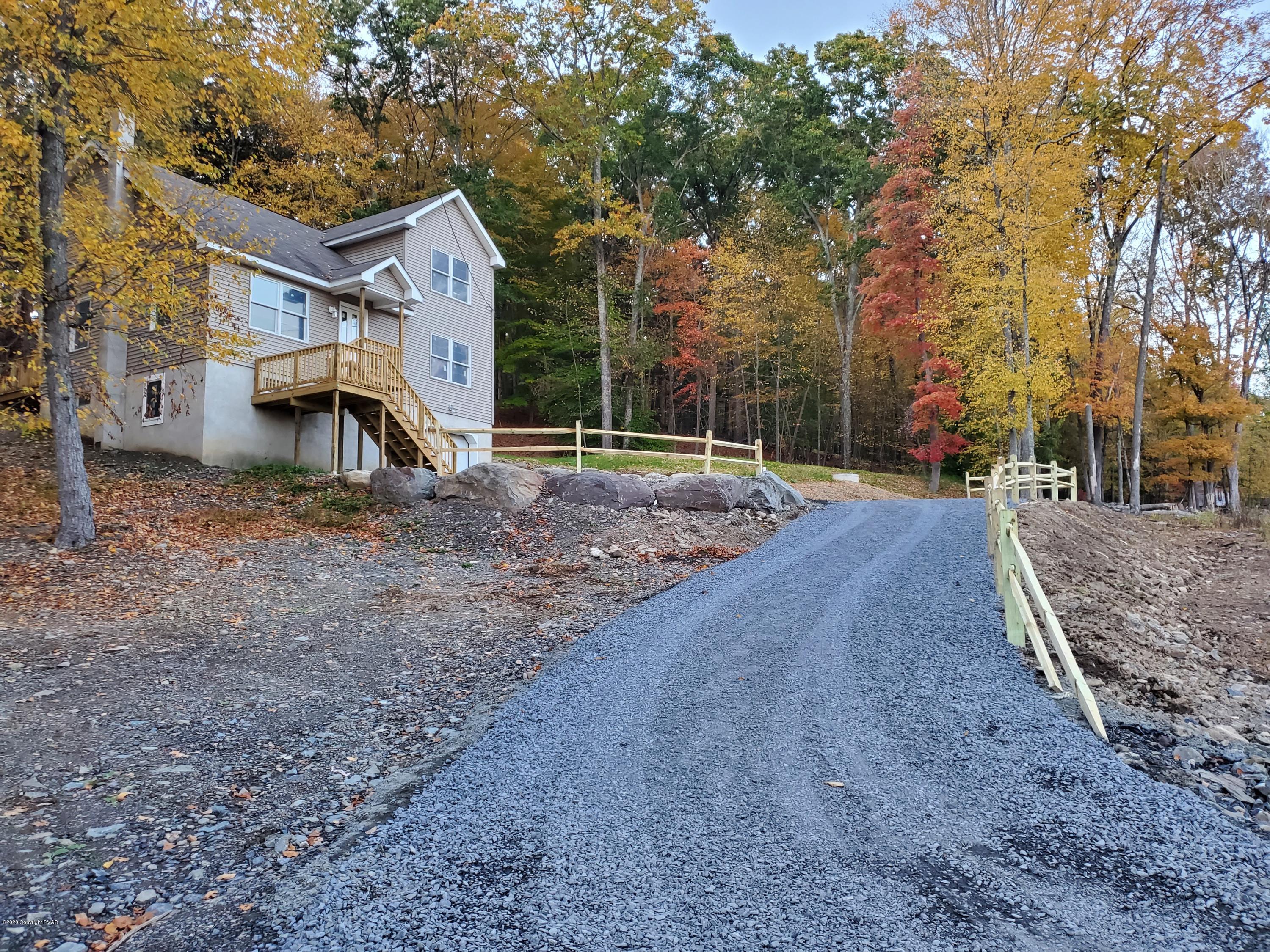 2273 Milford Road Bushkill, PA 18324 - Photo 1 of 23 a view of a yard with a house and a tree