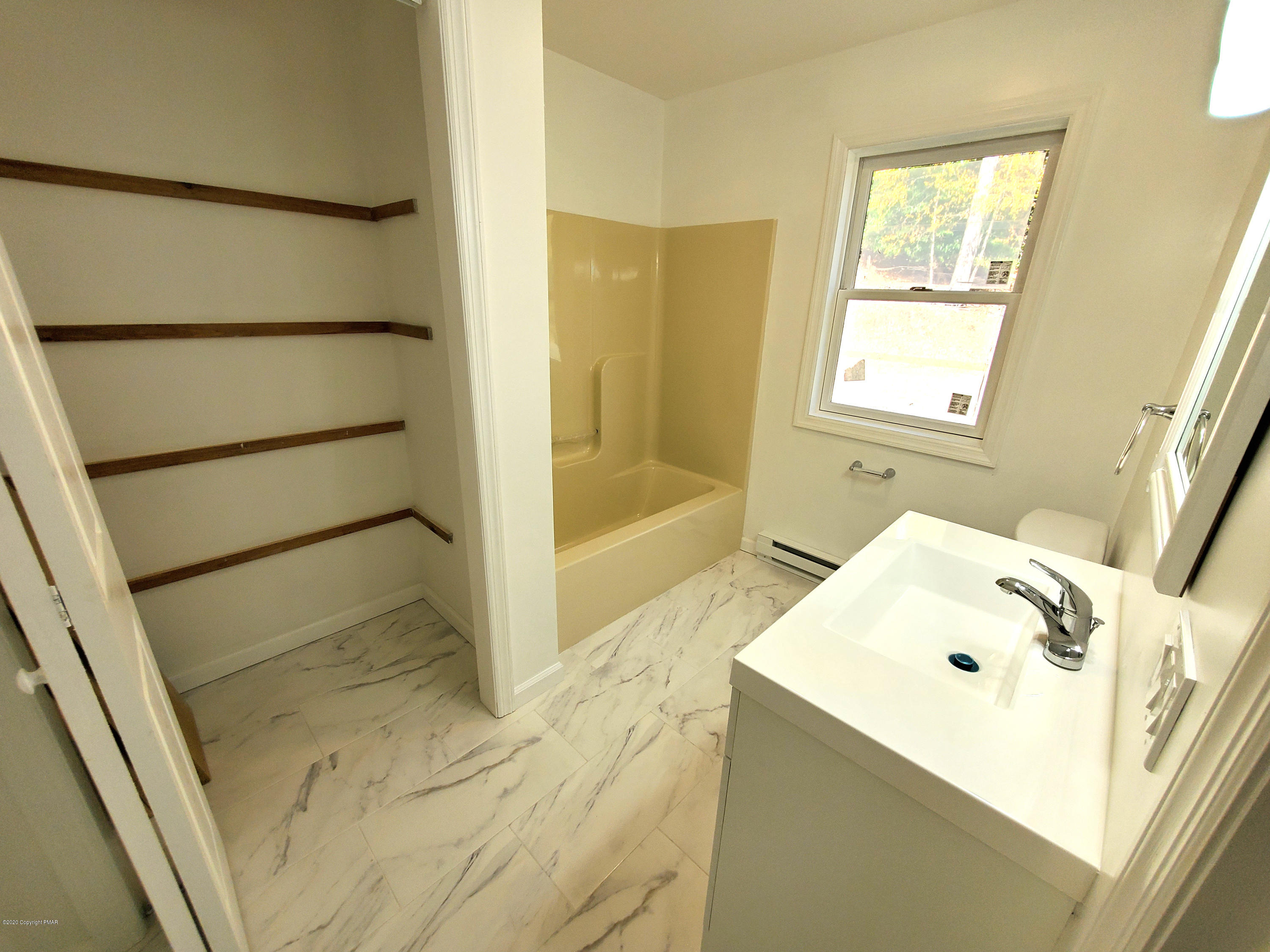 2273 Milford Road Bushkill, PA 18324 - Photo 11 of 23 a bathroom with a tub sink and a shower