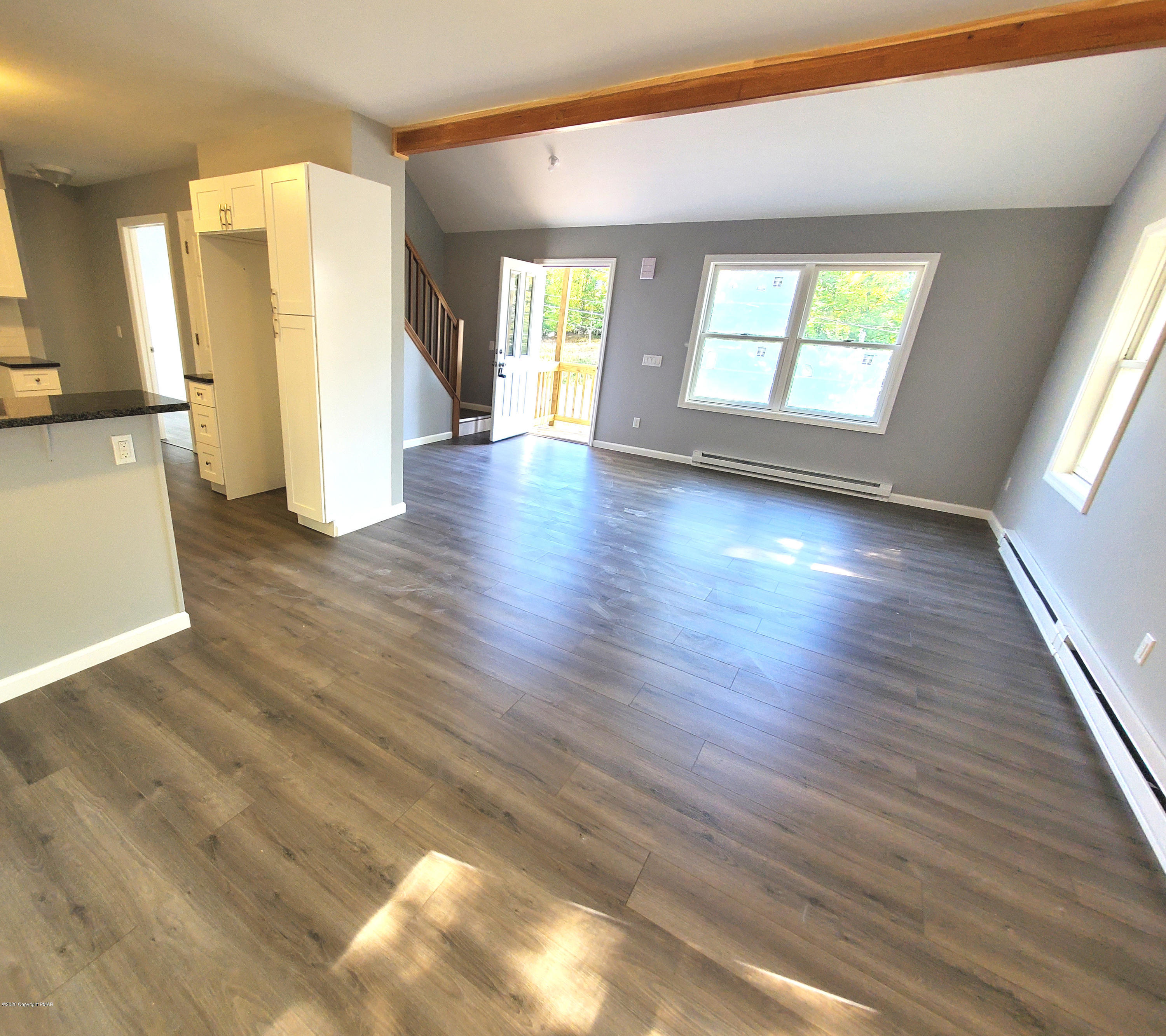 2273 Milford Road Bushkill, PA 18324 - Photo 2 of 23 a view of an empty room with wooden floor and a window