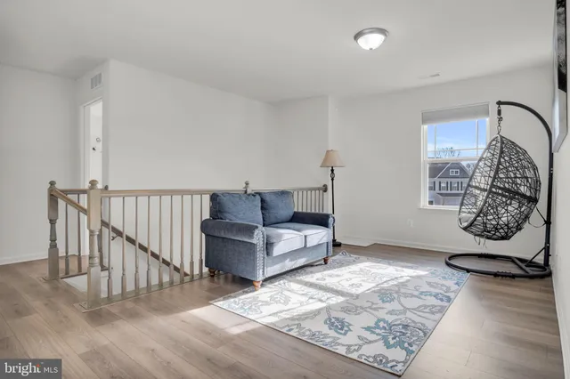 a living room with furniture and a rug