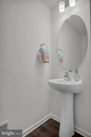 a bathroom with a sink and vanity