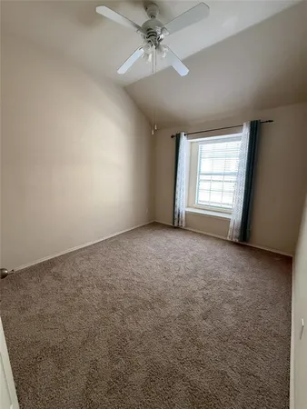 an empty room with a empty space and windows