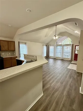 a large kitchen with a large window