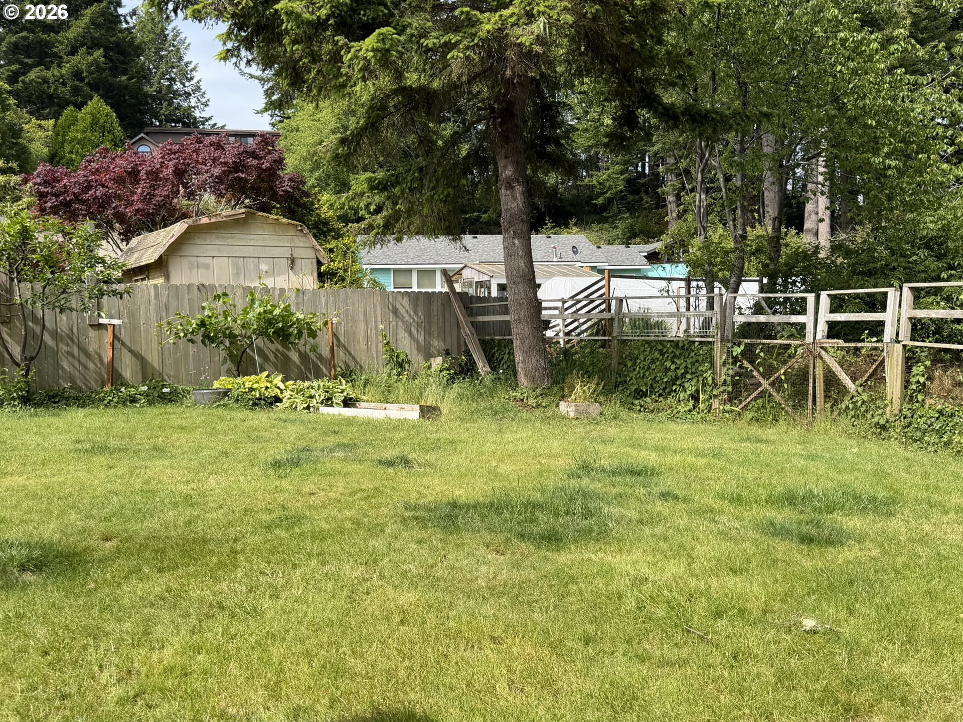 1372 Hampton Road Brookings, OR 97415 - Photo 42 of 42 a backyard of a house with table and chairs