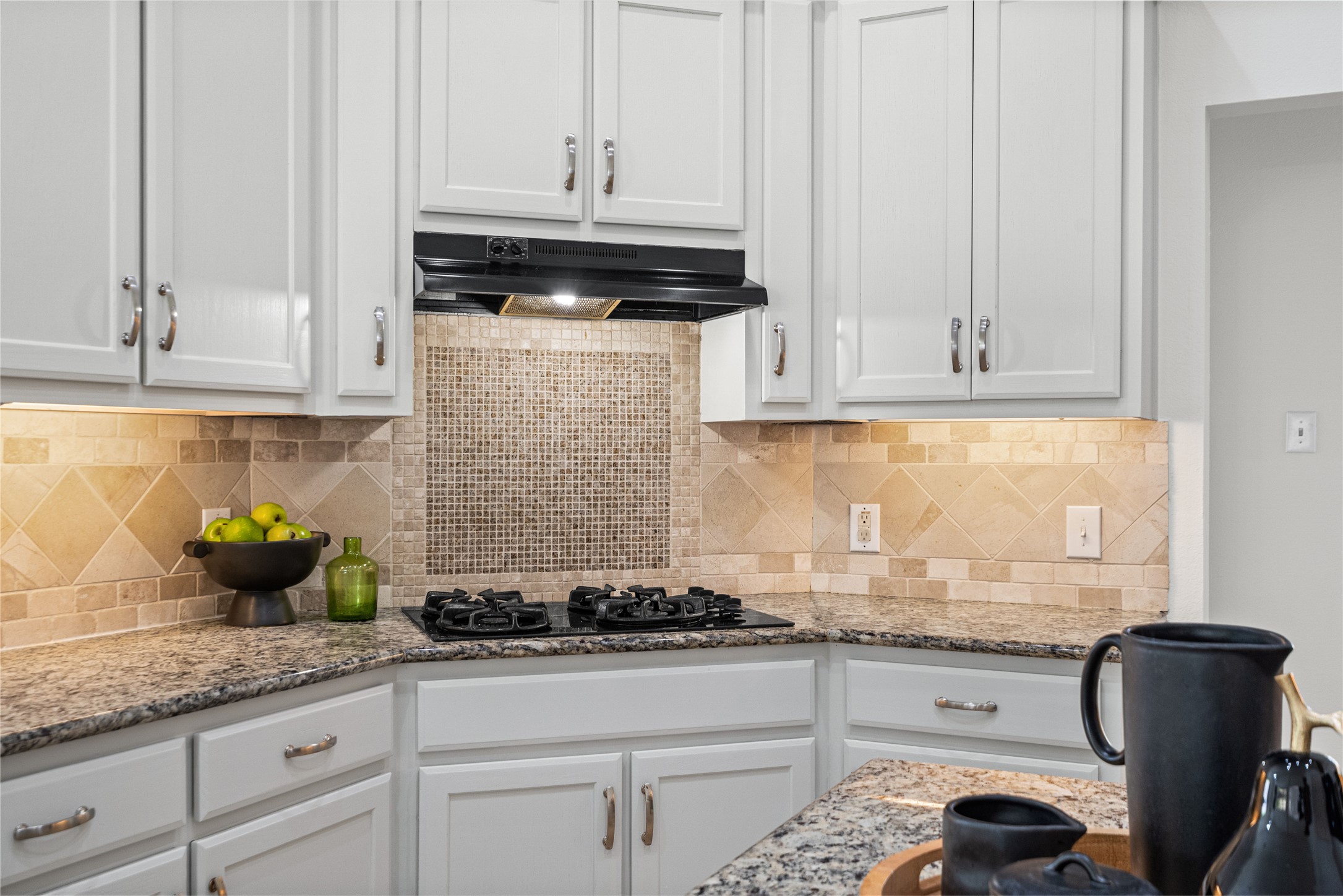 2920 Warwick Way Austin, TX 78748 - Photo 17 of 36 A well-appointed light and bright kitchen showcasing elegant granite counters and gas cooktop