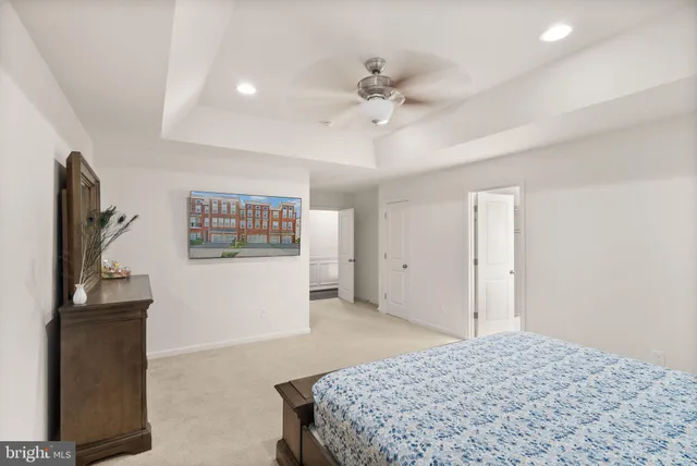 a bedroom with a bed and a television