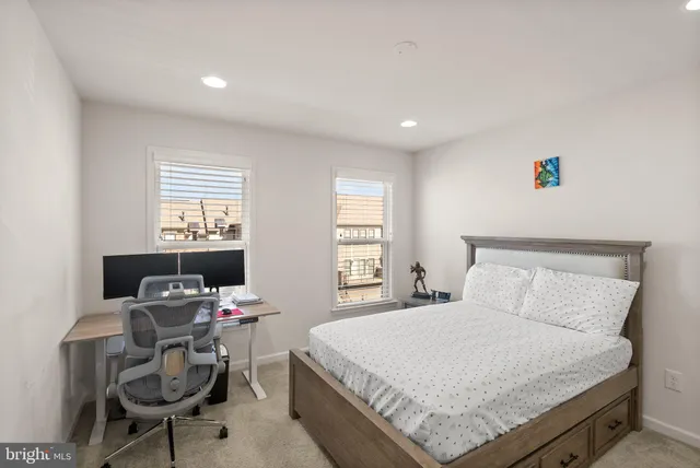 a bedroom with a bed and a cabinets