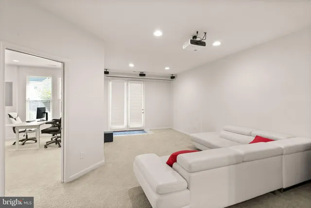 a living room with furniture and white walls