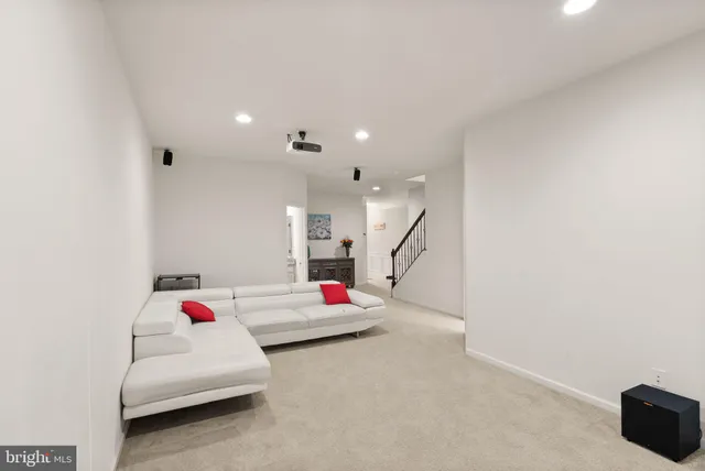 a view of a house with a barbeque and wooden floor