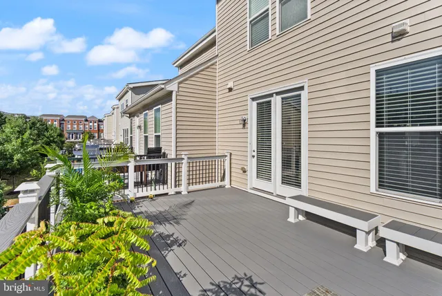 a front view of a building with a garden
