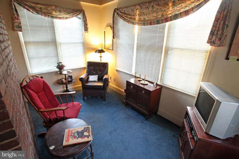 702 Murdock Road Baltimore, MD 21212 - Photo 23 of 25 a living room with furniture fireplace and a window