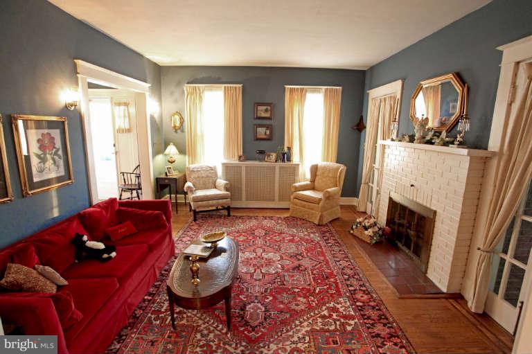 702 Murdock Road Baltimore, MD 21212 - Photo 6 of 25 a living room with furniture and a fireplace