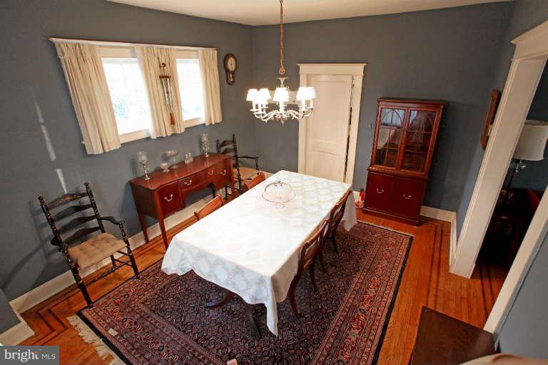 702 Murdock Road Baltimore, MD 21212 - Photo 7 of 25 a room with chandelier fan and wooden floor