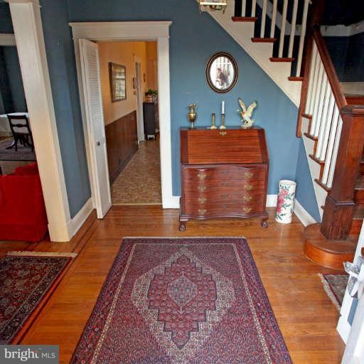 702 Murdock Road Baltimore, MD 21212 - Photo 9 of 25 an empty room with wooden floor and furniture