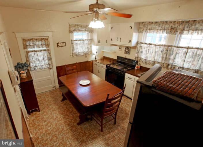 702 Murdock Road Baltimore, MD 21212 - Photo 10 of 25 a dining room with furniture and wooden floor