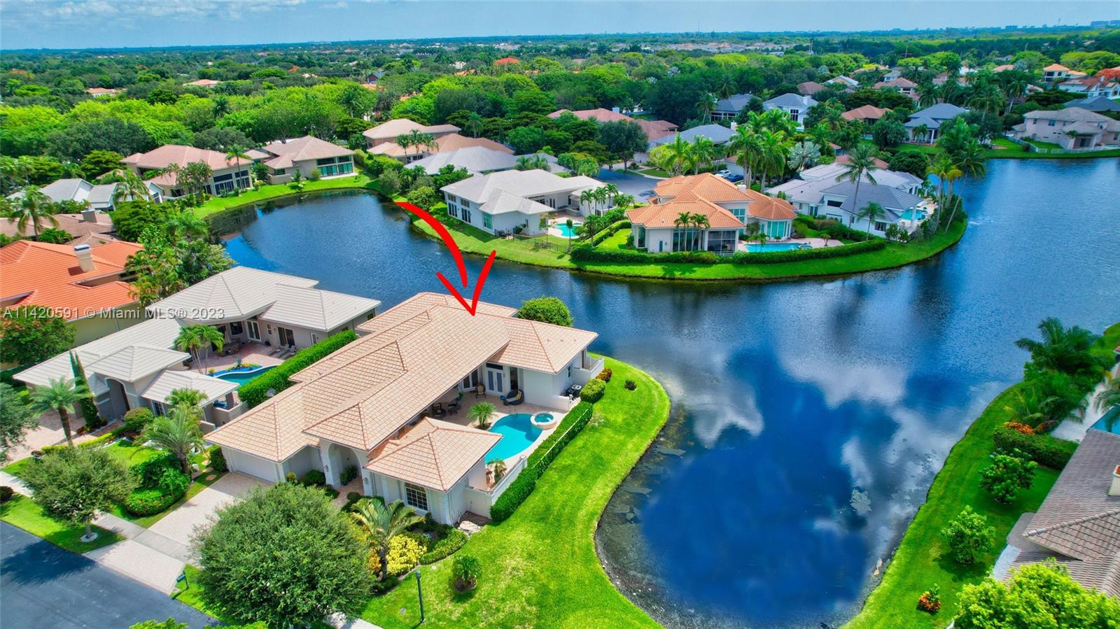 6398 Northwest 32nd Terrace Boca Raton, FL 33496 - Photo 3 of 45 an aerial view of a house with a garden and lake view