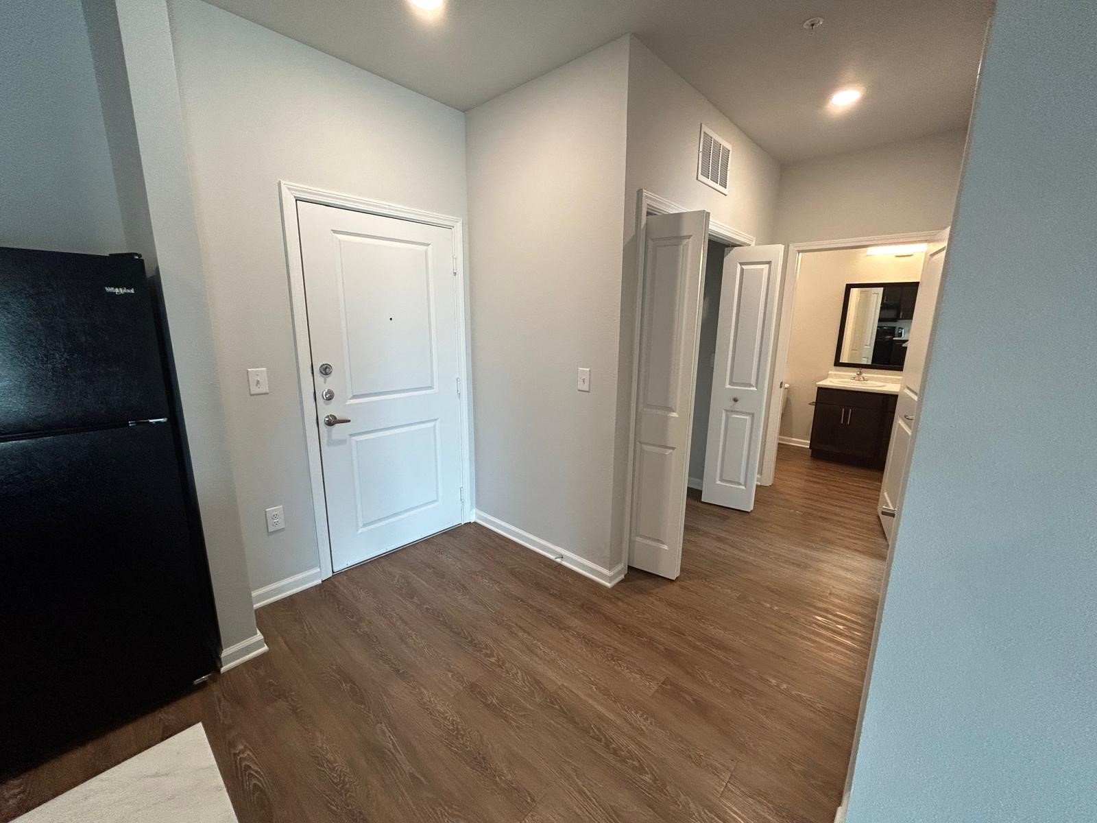 2136 West 34th Street, Unit 146 Houston, TX 77018 - Photo 5 of 8 wooden floor in an empty room