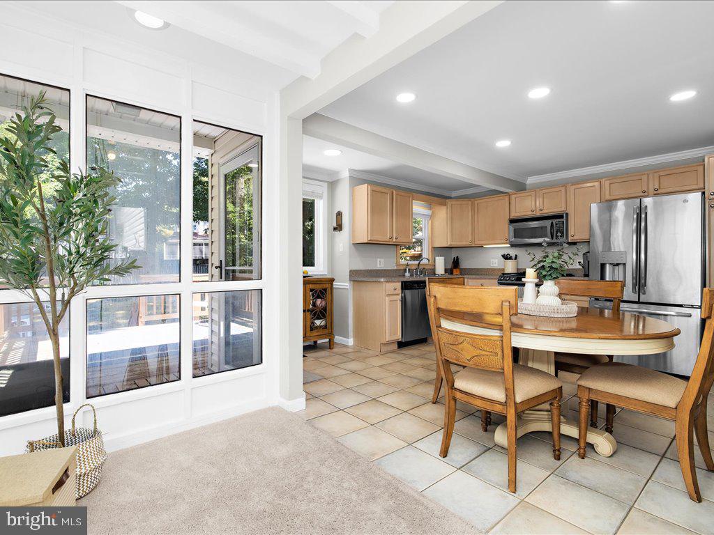 704 Roxboro Road Rockville, MD 20850 - Photo 12 of 43 Sunroom looking into Kitchen and back Deck