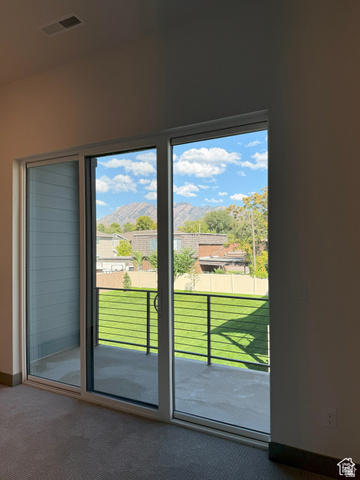 8087 South 615 East, Unit 3 Sandy, UT 84070 - Photo 20 of 23 Sliding glass door leading to an outdoor patio with cable railing