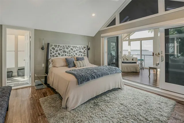 a bedroom with a large bed and a couch