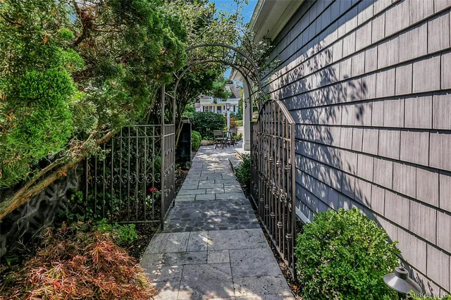 a view of a pathway with a backyard