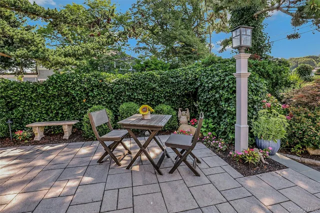 a view of backyard with sitting area