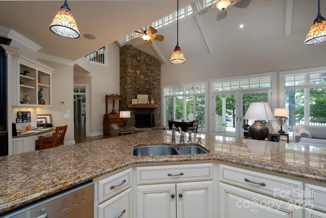 a kitchen with counter top space and stainless steel appliances