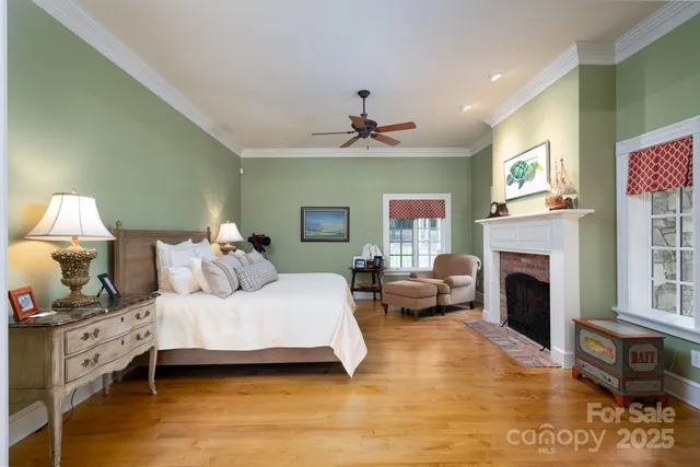 a bedroom with a bed and a fireplace