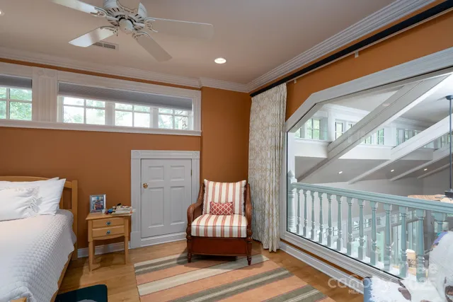 a bedroom with furniture and a window
