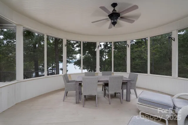a dining room with furniture a chandelier and a rug