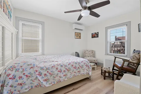 a bedroom with a bed furniture and a window
