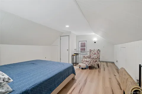 a view of a livingroom with furniture and wooden floor