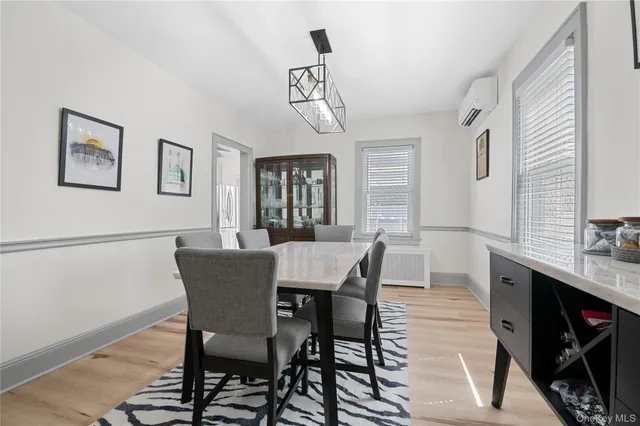 a view of a dining room with furniture and window