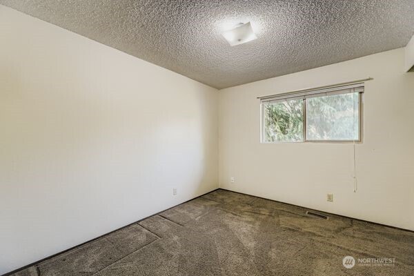114 212th Street Southeast Bothell, WA 98021 - Photo 13 of 24 an empty room with a window
