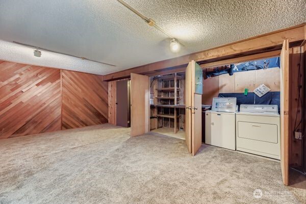 114 212th Street Southeast Bothell, WA 98021 - Photo 20 of 24 a view of walk in closet with clothes and shoes