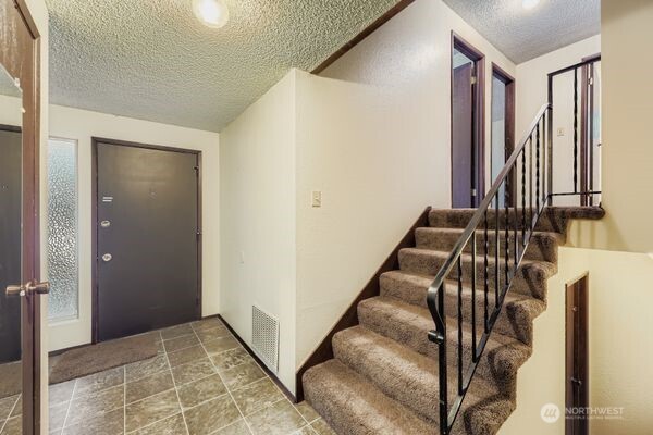 114 212th Street Southeast Bothell, WA 98021 - Photo 23 of 24 a view of staircase with rug