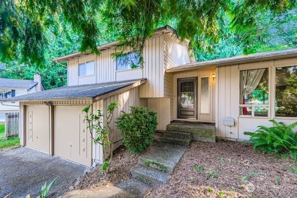 114 212th Street Southeast Bothell, WA 98021 - Photo 4 of 24 a front view of a house with garden