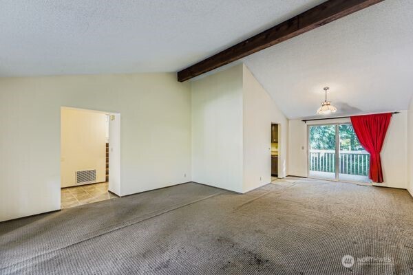 114 212th Street Southeast Bothell, WA 98021 - Photo 7 of 24 a view of a big room with windows and chandelier