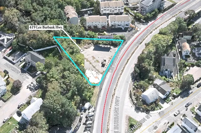 an aerial view of a house with outdoor space