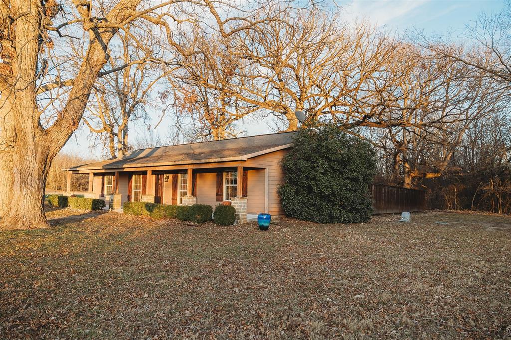 6078 East Line Road Whitewright, TX 75491 - Photo 14 of 32 View of front of house with a porch