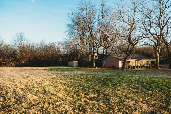 a big yard with trees