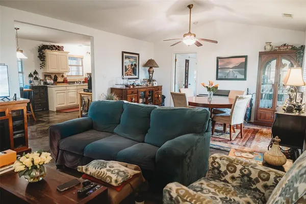 a living room with furniture fireplace and a chandelier