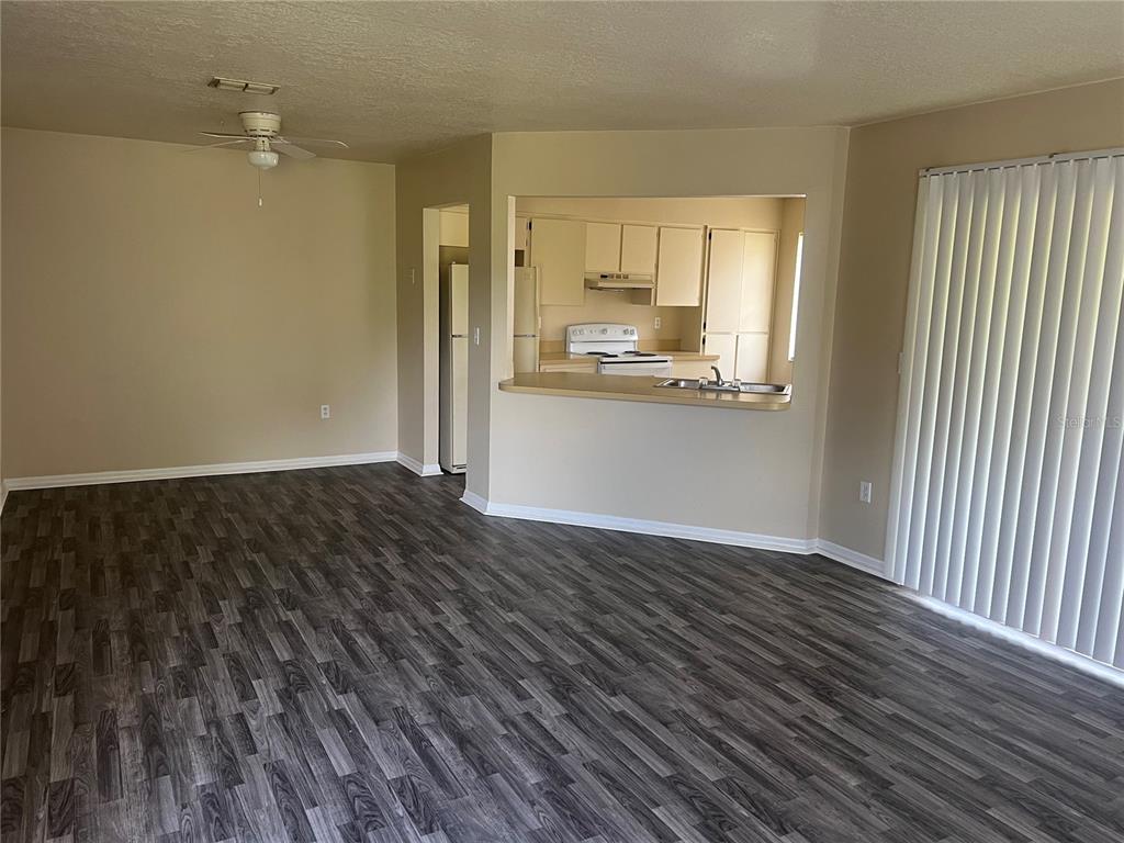 7266 Pond Circle Spring Hill, FL 34606 - Photo 2 of 11 a view of a kitchen with wooden floor