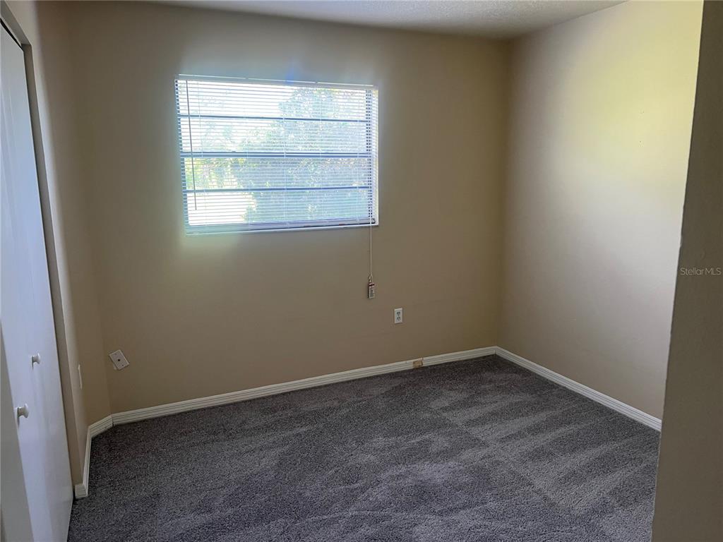 7266 Pond Circle Spring Hill, FL 34606 - Photo 7 of 11 an empty room with a window
