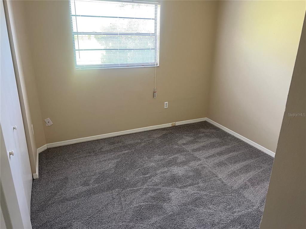 7266 Pond Circle Spring Hill, FL 34606 - Photo 10 of 11 an empty room with a window