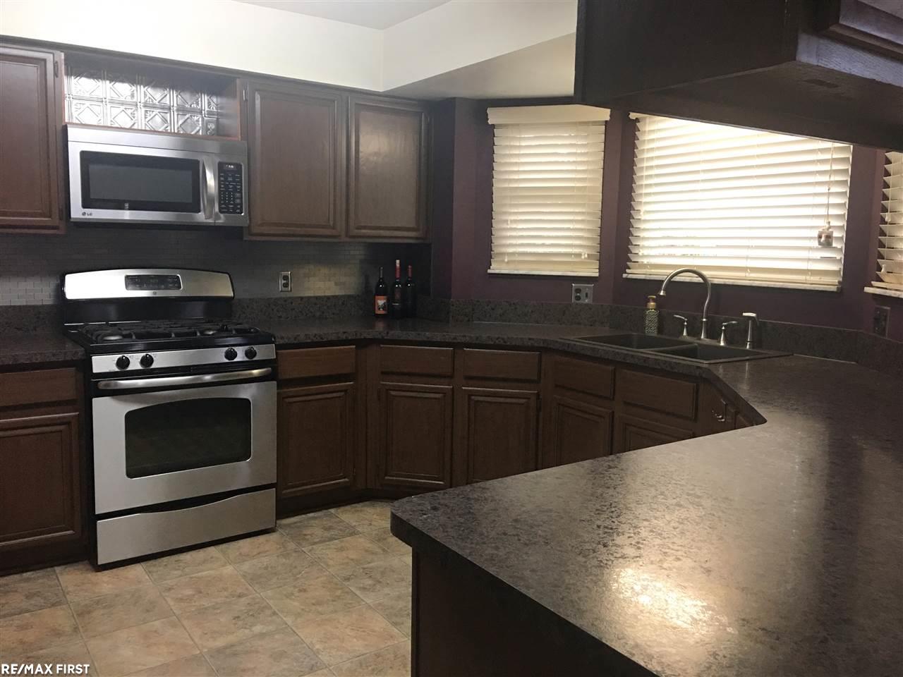 20700 Dunham Road Clinton Township, MI 48038 - Photo 7 of 36 New counter tops, flooring and refurbished cabinets