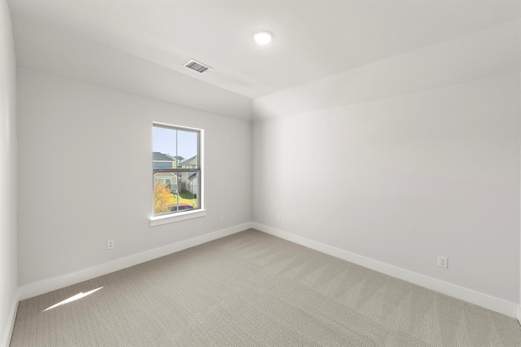 2917 Andesite Road McKinney, TX 75071 - Photo 22 of 27 an empty room with a window