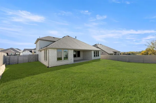 a house with garden in front of it