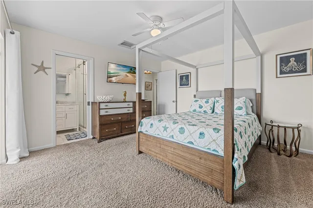 a bedroom with a bed and a cabinets