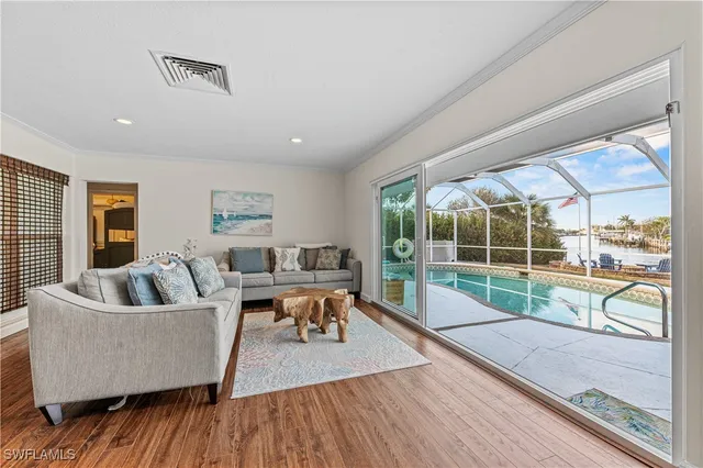 a living room with couch and a large window